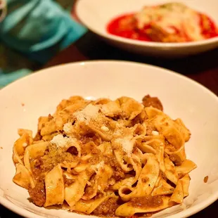a plate of pasta with meat and cheese