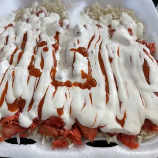a meal in a styrofoam container