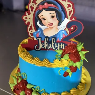 a cake with a picture of snow white