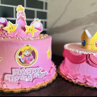 two decorated cakes on a table