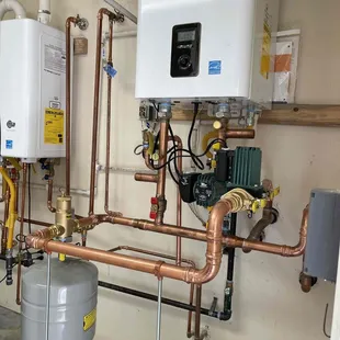 replaced two 80 gallon tank water heaters with new efficient Navien Tankless water heaters