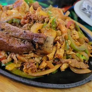 Fajitas de lujo Steak, shrimp, carnitas, chorizo, Chicken, and a spare rib