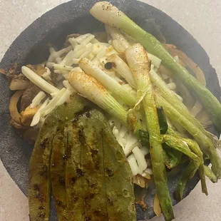 Molcajete steak chicken shrimp ,salad  rice and beans delicious