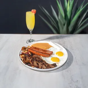 Cosala/ Prime meat with sausage link and eggs cooked to choice