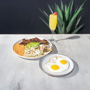 Badiraguato/ Prime meat with Chilaquiles and eggs cooked to choice