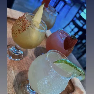 three margaritas on a table