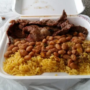 One of my favorites marinated steak with yellow rice and beans... Its higher then the regular options but at $6 who cares.