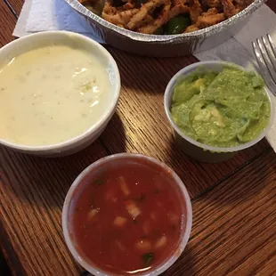 Queso dip, guacamole dip and salsa!