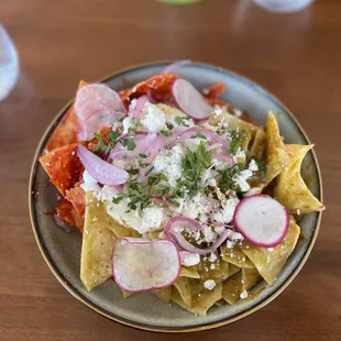 Chilaquiles divorciados. You can add a protein of choice. I personally prefer just an egg on top.