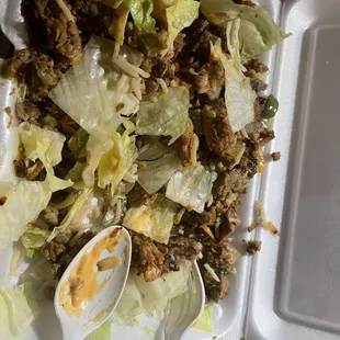 a salad in a styrofoam container
