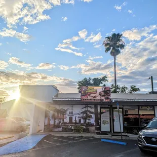 a car parked in front of a restaurant