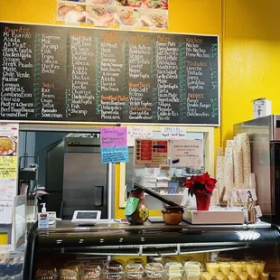 menus on a yellow wall