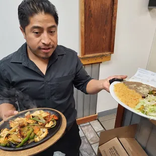 Proud of accomplishing his dream of owning his business!