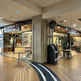 Near the sears entrance. Just a little past the stairs.