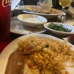 Beans and rice with cilantro in the back and margarita