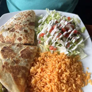 Steak fajita quesadilla with onions bell peppers, mushrooms and tomatoes served with rice and salad $14.99