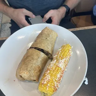 Steak burrito with sweet corn