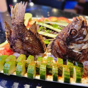 a plate of fish and vegetables