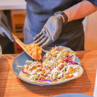 a chef preparing a plate of food
