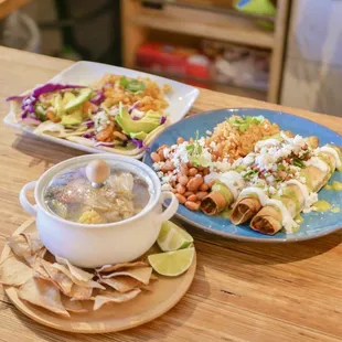 two plates of mexican food and a bowl of soup