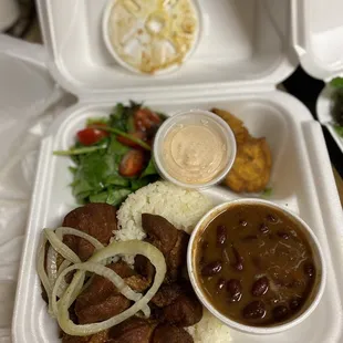 This is the fried pork chunks with rice and beans.