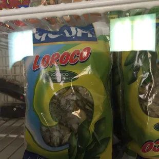 two bags of broccoli in a refrigerator