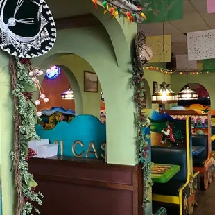 Booths and the colorful wall.