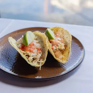 Red Snapper Tacos - smoked paprika chile, agave ancho crema,
shredded cabbage, pico de gallo, fresh cilantro