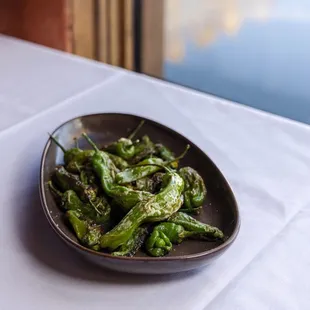 Shishito Peppers - blistered and tossed with garlic oil, lime, and salt