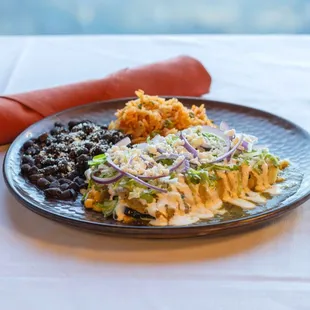 Veggie Enchiladas - roasted sweet corn, onion &amp; poblano chile, tomatillo salsa verde,
crema mexicana, lettuce, red onion, queso fresco