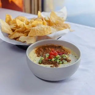 Loaded Queso - chile con queso with charro beans and seasoned ground beef