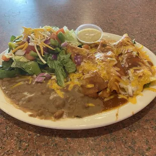 Seafood enchiladas with salad instead of rice