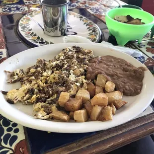 Machacado con huevo with potatoes and refried beans