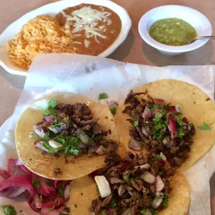 Tacos de carne asada, salsa verde and rice and beans