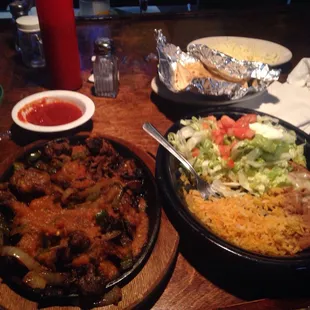 two plates of mexican food on a table