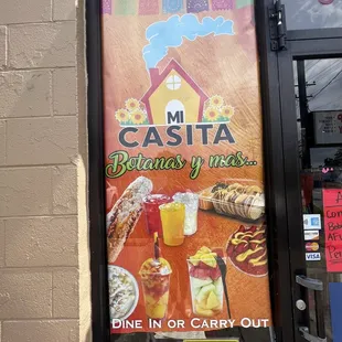 a sign in front of a restaurant