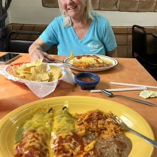 my chilies Renos plate in the foreground and Pat&apos;s border burrito in front of her. Homemade chips and salsa to die for in the middle.