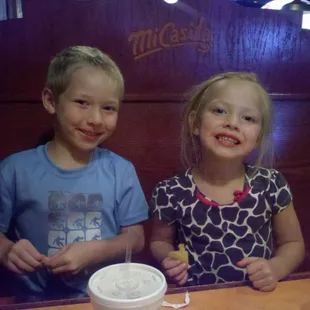 The kids enjoying the chips and salsa.