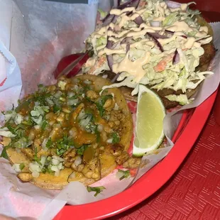 The taco on the left , is the Pollo Asado (grilled chicken). Fish taco on the right :)