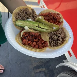 2 asada tacos, 1 adobada, 1 chorizo, generous portions! Comes with grilled jalapeños and grilled onions. Wow!