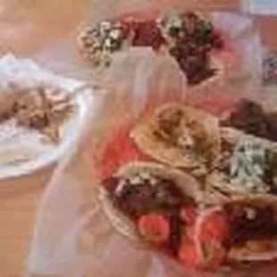 a variety of tacos on a table