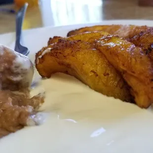 Plantains, cream and refried beans (made with vegetable oil)