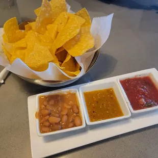 Chips and Dips.  Beans , citrus spicy salsa , and tastee salsa