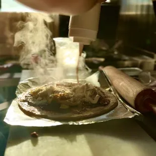 Baleada :

Hand made flour tortilla with re-fried beans, tri-blend cream, avocado, &amp; scrambled eggs !