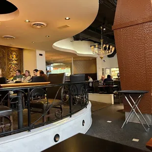 people sitting at tables in a restaurant