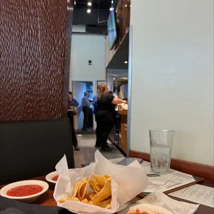 View from the worst table in here.  The bathroom is on the other side of this wall!