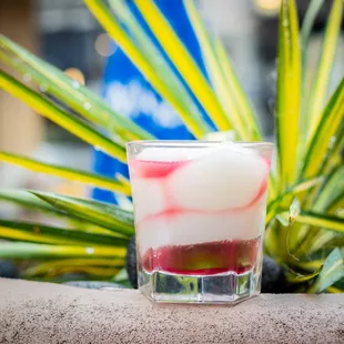 a shot of a drink in a glass