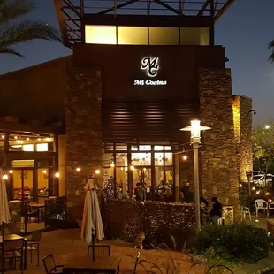 the outside of a restaurant at night