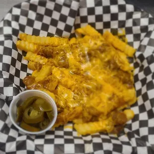 a basket of cheesy fries