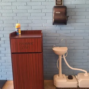 a toilet and sink in a public restroom